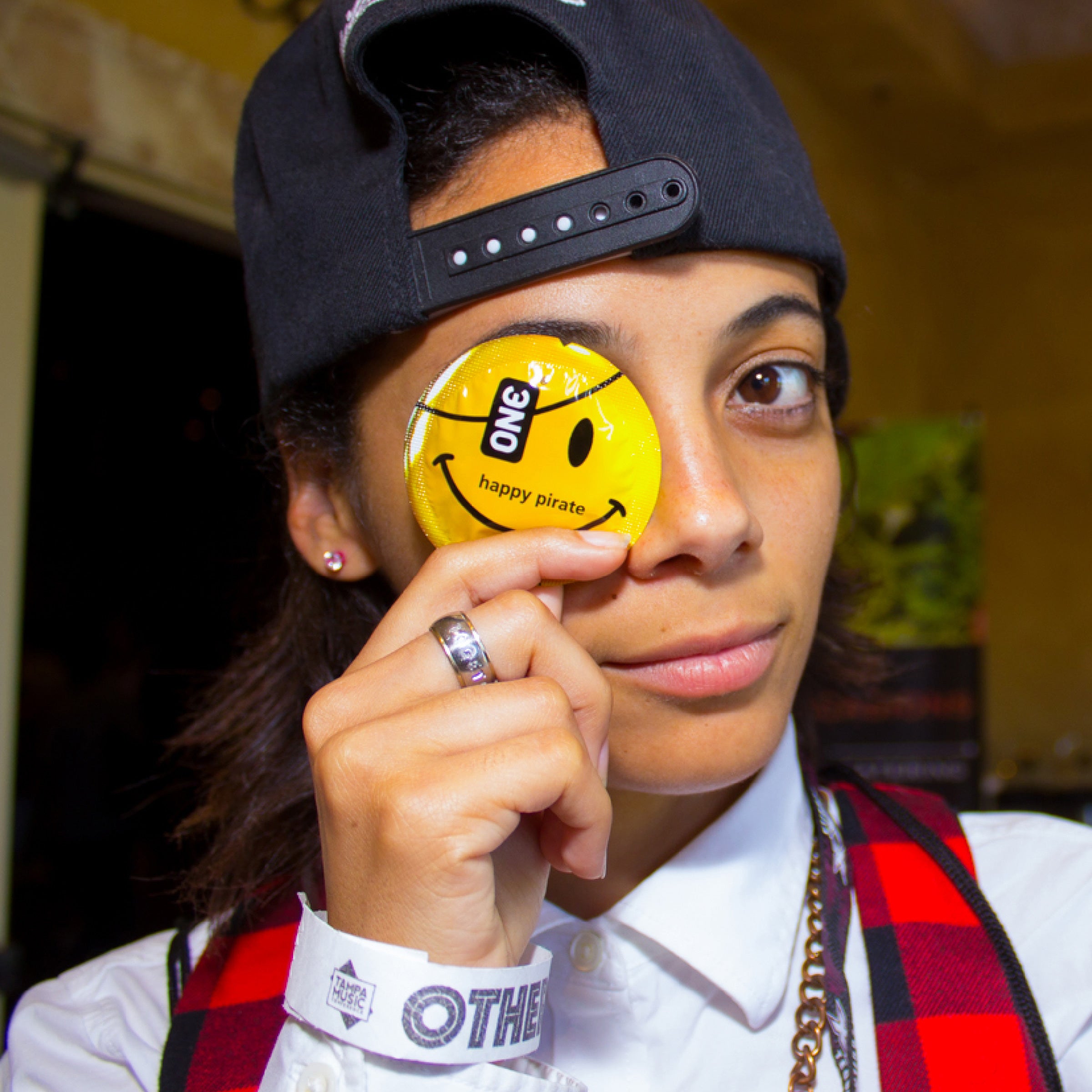 ONE Community person with yellow condom.