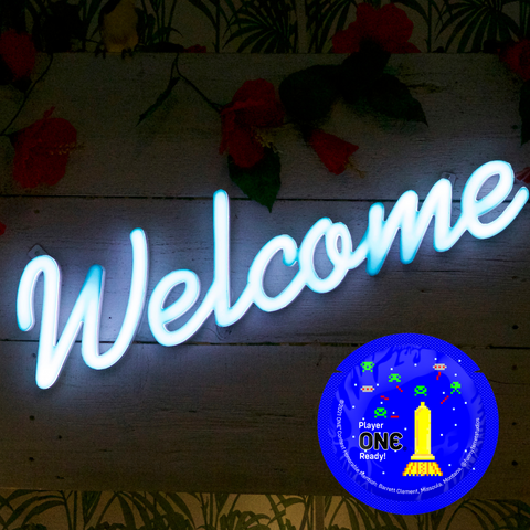 An image that says WELCOME with a blue condom wrapper that is round
