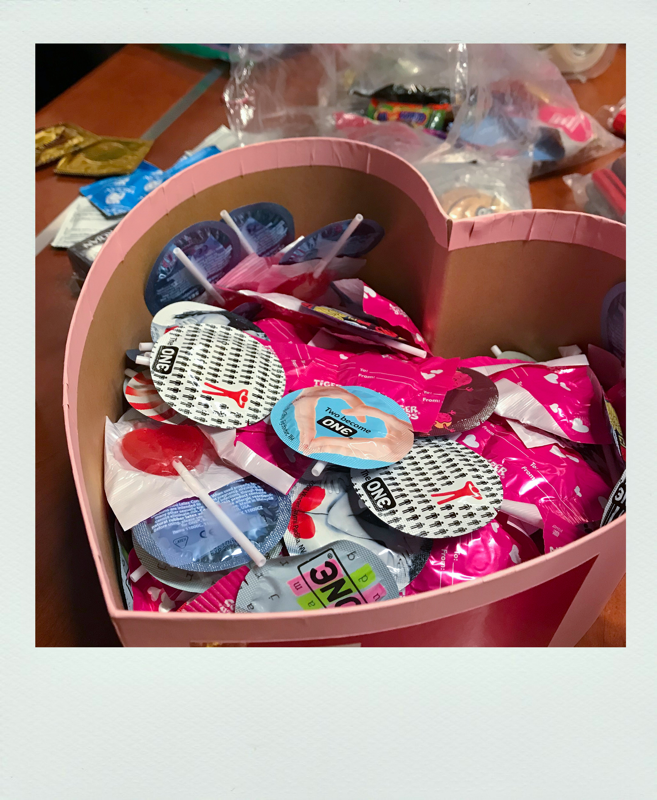 heart shaped box with one condoms.
