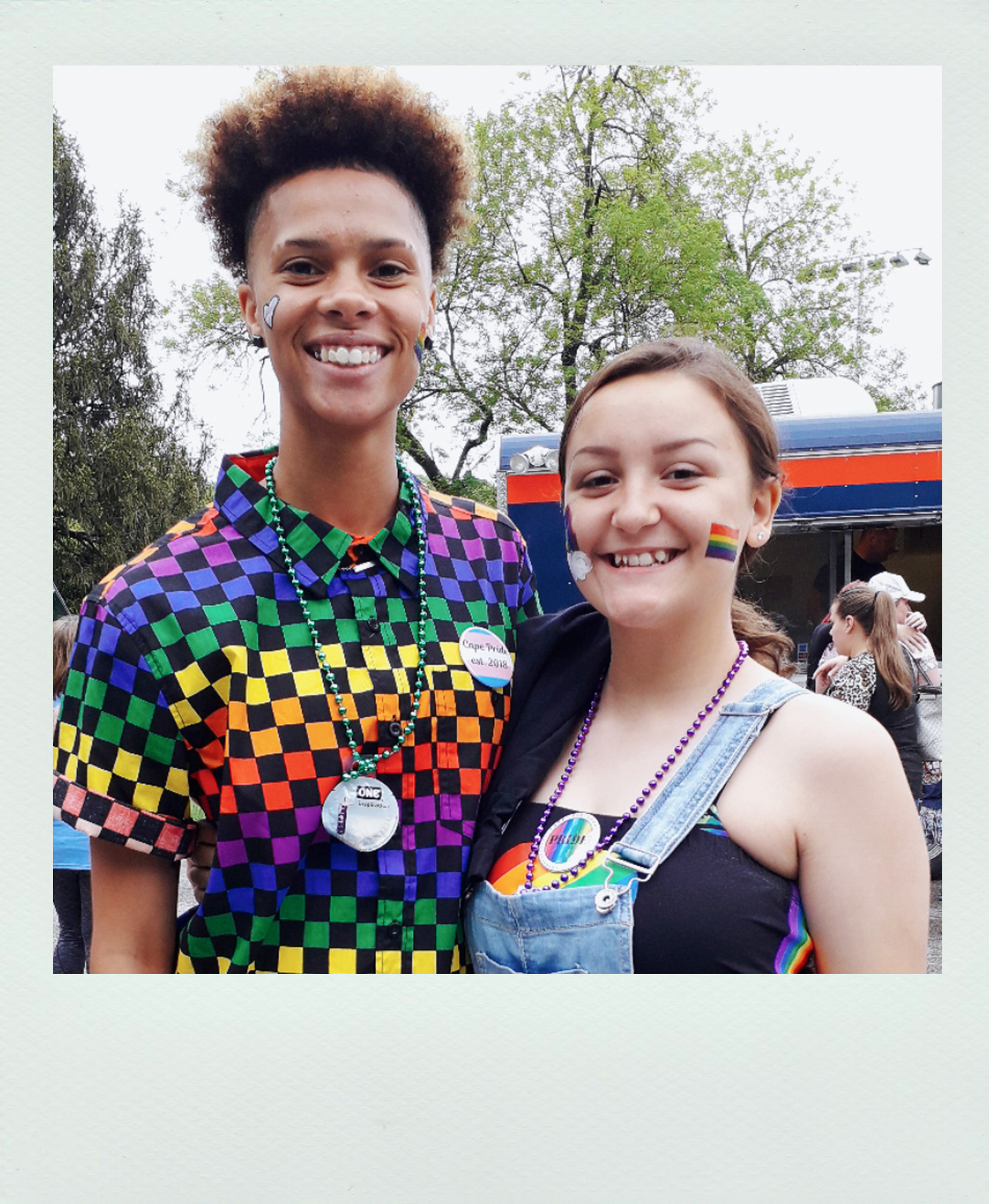 Two people at a pride event.